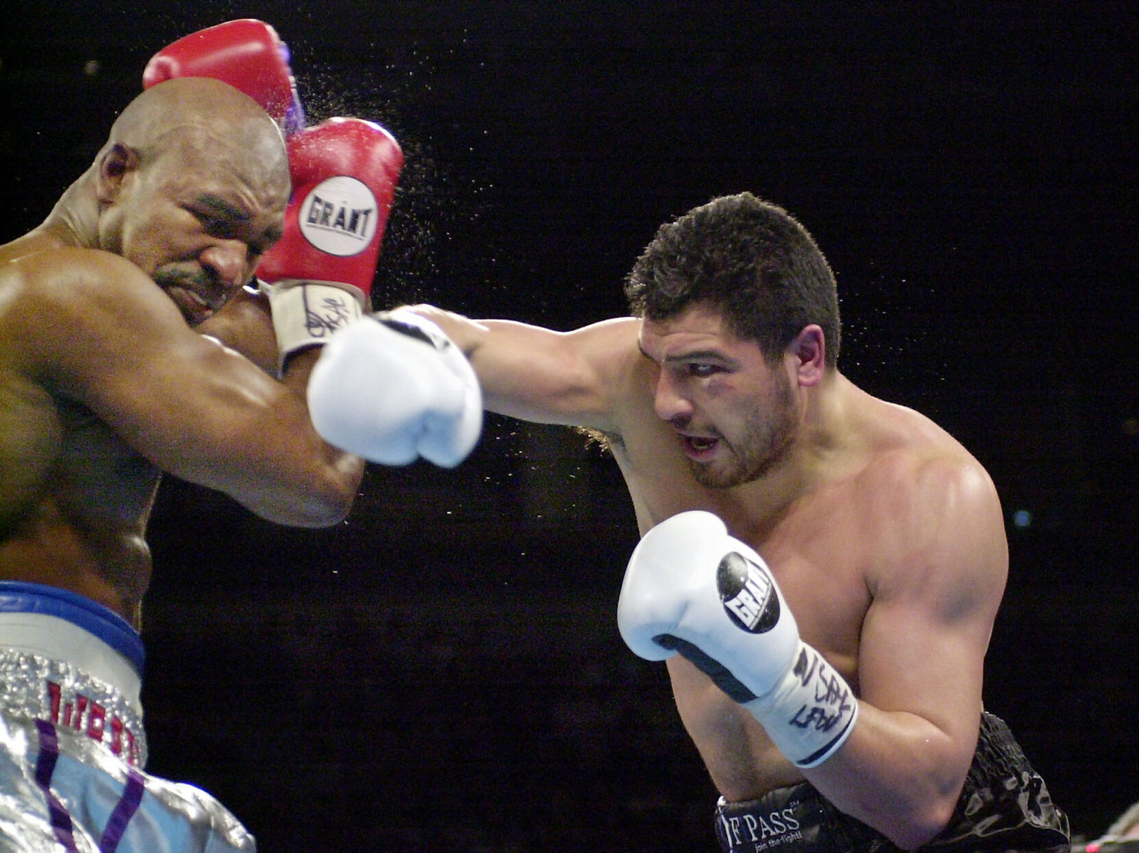 2001: John Ruiz becomes first Hispanic heavyweight champion by knocking down Evander Holyfield